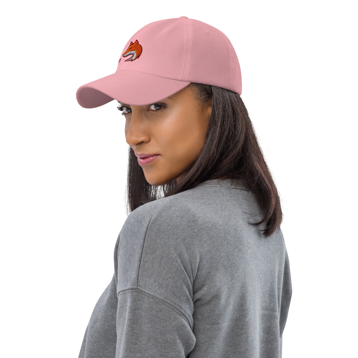 Woman wearing pink baseball cap with embroidered fox and the word "Zero" on the front, suggesting the phrase "Zero Fox" or "Zero Fcks."