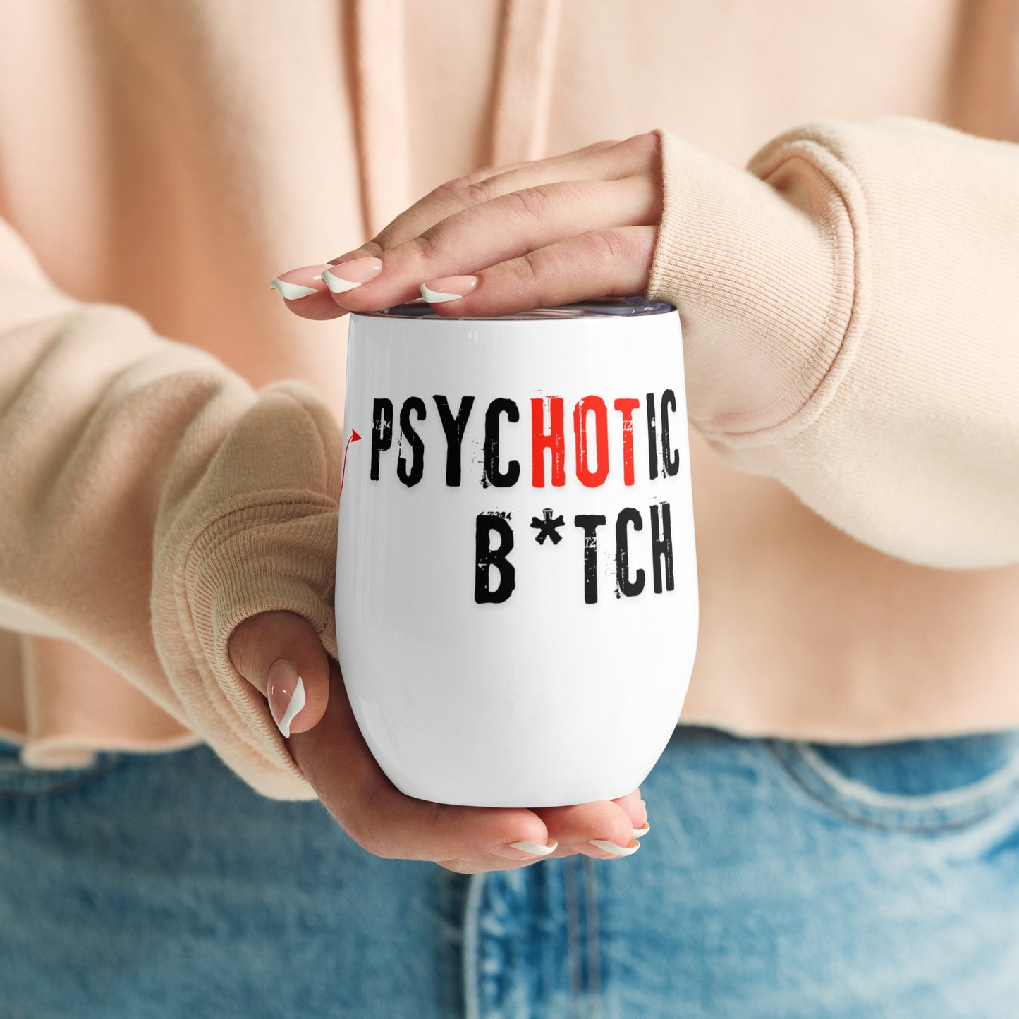 Wine tumbler with text 'I am the PsycHOTic B*tch Everyone Told You About.' Tumbler is held by a woman.