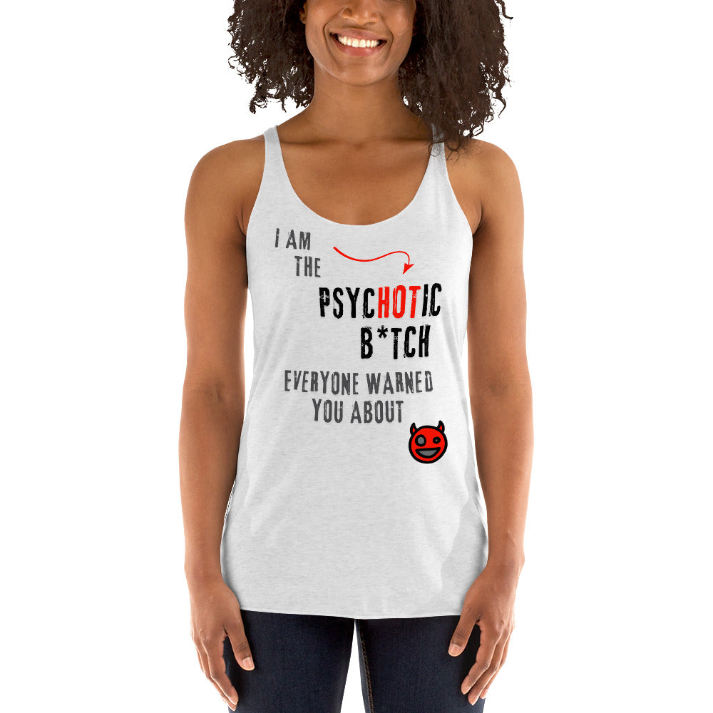 Woman wearing a white racerback tank top featuring bold 'I am the PsycHOTic B*tch Everyone Warned You About' text, edgy design, and soft, lightweight fabric for a flattering fit.