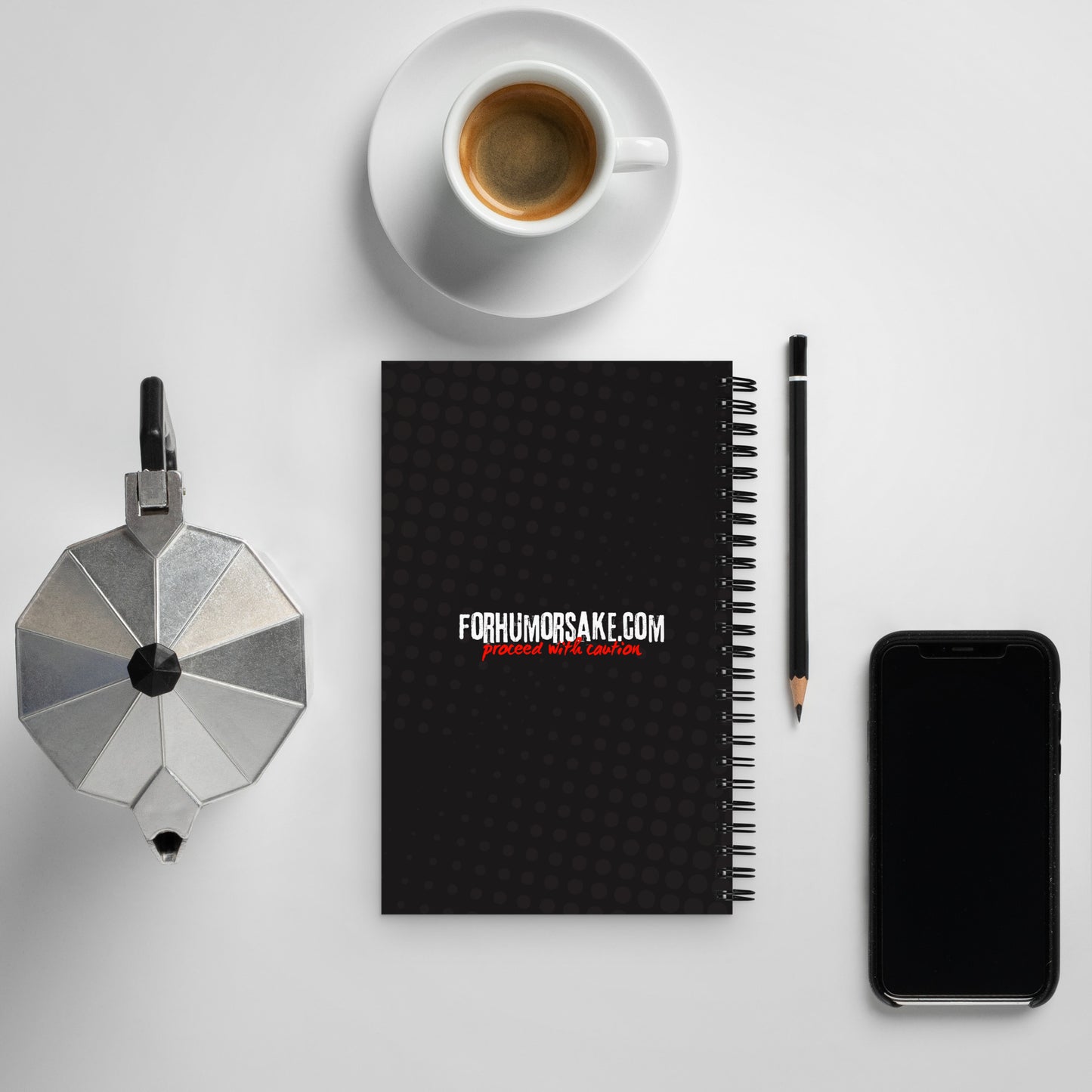 Back of a spiral notebook with text 'Your Password Is Safe With Me, Don't Worry' and an image of a hacker cat coding on a laptop.
