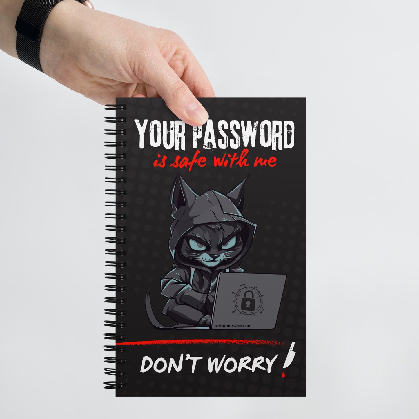 Spiral notebook with text 'Your Password Is Safe With Me, Don't Worry' and an image of a hacker cat coding on a laptop.