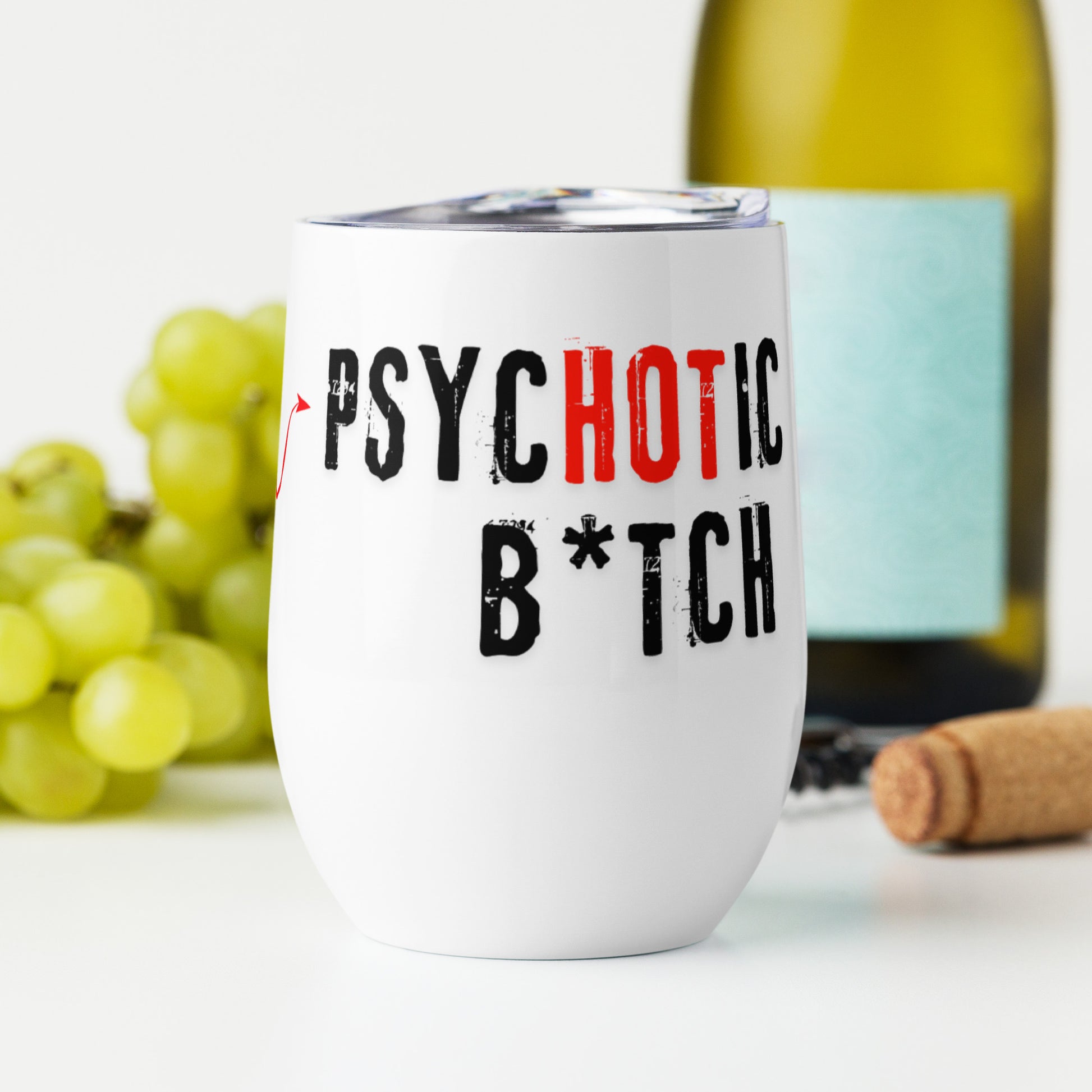 Wine tumbler with text 'I am the PsycHOTic B*tch Everyone Told You About' in front of a wine bottle.
