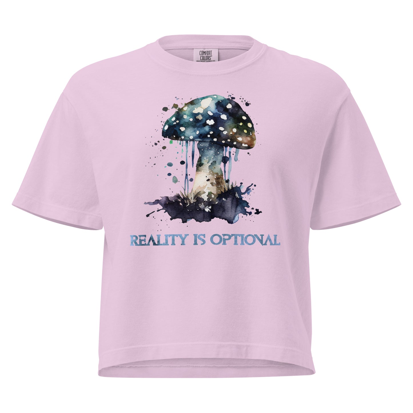 Pink mushroom t-shirt with psychedelic watercolor design and “Reality Is Optional” text.
